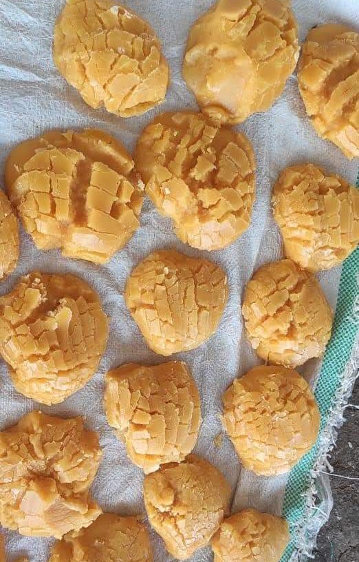 Freshly shaped jaggery lumps cooling on cloth at Vintage Jaggery